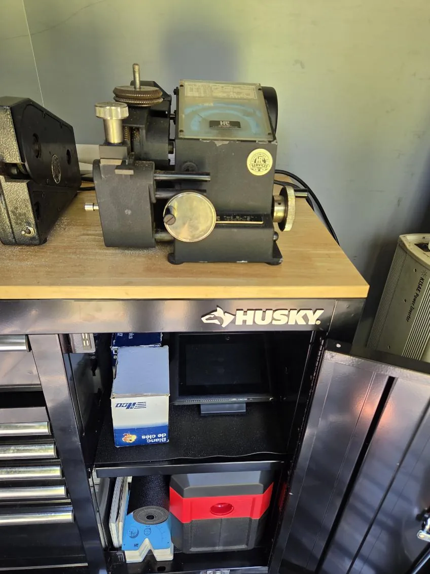 Specialized locksmith machine and workbench tools inside the van