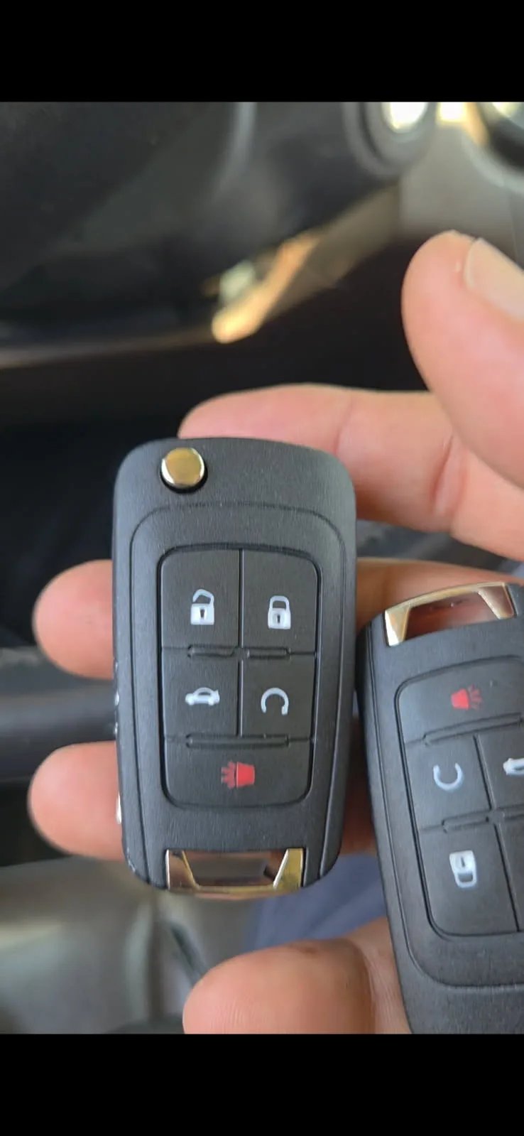 Newly programmed car key fobs ready for handoff